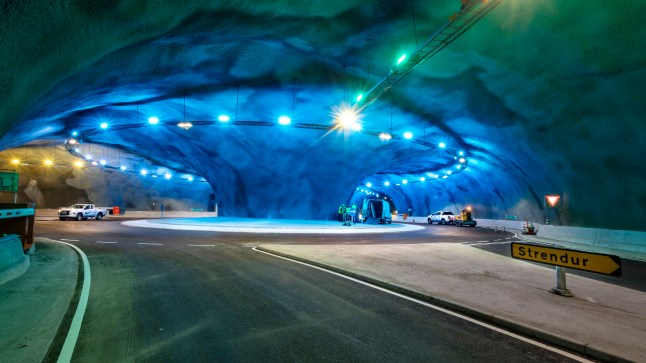 The Faroe Islands are set to open an under-sea roundabout following more than three years of construction. The underwater tunnels connect the islands of Streymoy and Eysturoy in a network some 6.8 miles (11km) long. The network is scheduled to open on 19 December. The tunnel network will come as a relief to residents, cutting down the travel time between the capital Torshavn and Runavik, from an hour and 14 minutes to just 16 minutes. The lowest point of the tunnel network is 187m (613ft) below sea level. The Faroe Islands, a series of 18 islets in the North Atlantic located halfway between Iceland and Norway, constitute an autonomous region of Denmark. A test-run involving emergency services is scheduled for 17 December, according to local media. The roundabout in the middle of the network will contain artwork by Faroese artist Trondur Patursson. The art will comprise sculptures and light effects. Those using the tunnels will be required to pay a toll fee. Local.fo, a Faroese news website, reports that passenger cars will have to pay 75 Danish Krona one way. Photo by Olavur Frederiksen via ABACAPRESS.COM