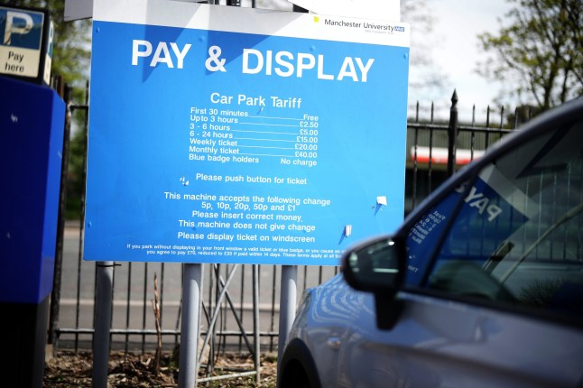 MANCHESTER, ENGLAND - APRIL 14: Car parking signs are displayed at Manchester Royal Infirmary on April 14, 2022 in Manchester, England. Free parking in hospital car parks for NHS staff was introduced by the government in July 2020 during the pandemic but ended on March 31, 2022. (Photo by Christopher Furlong/Getty Images)