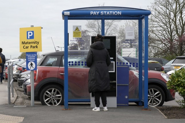 MANCHESTER, ENGLAND - APRIL 14: People pay for parking at Wythenshawe Hospita on April 14, 2022 in Manchester, England. Free parking in hospital car parks for NHS staff was introduced by the government in July 2020 during the pandemic but ended on March 31, 2022. (Photo by Christopher Furlong/Getty Images)