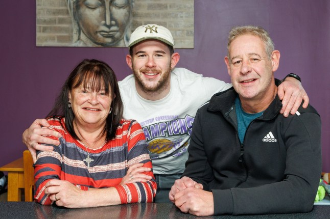 16/11/24 Conor Lindsay pictured with parents Carmel & Gary at home in Harviestoun Grove, Tillicoultry.
