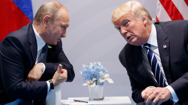 FILE - President Donald Trump meets with Russian President Vladimir Putin at the G-20 Summit in Hamburg, July 7, 2017. A Pew survey of democracies around the world finds that views of the U.S. as a model for democracy are slipping and confidence in Trump, the presumptive Republican presidential nominee is on par with Russian President Vladmir Putin and Chinese President Xi Jinping. (AP Photo/Evan Vucci, File)
