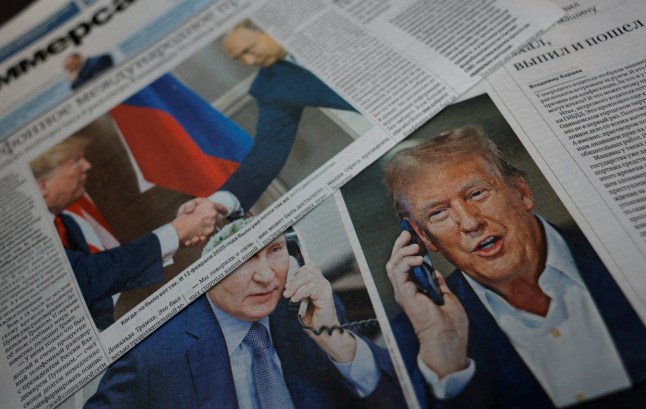 FILE PHOTO: Daily newspapers with covers, dedicated to the recent phone call of Russian President Vladimir Putin and U.S. President Donald Trump, are laid out at a newsstand in a street in Moscow, Russia, February 13, 2025. REUTERS/Maxim Shemetov/Illustration/File Photo/File Photo