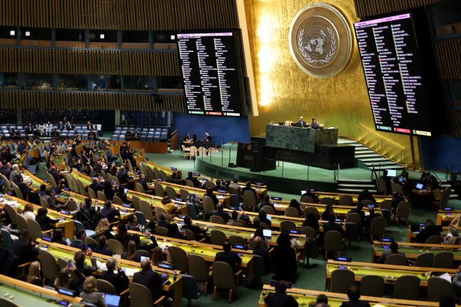 Ambassadors vote on a resolution to reaffirm Ukraine's terroritorial integrity, during a United Nations General Assembly meeting on the third anniversary of Russia's invasion of Ukraine, at UN Headquarters in New York City on February 24, 2025. Defying Kyiv and its European allies, Washington plans on February 24 to submit to the UN Security Council and General Assembly a draft text that calls for a "swift end" to the Ukraine conflict but makes no reference to its territorial integrity. (Photo by CHARLY TRIBALLEAU / AFP) (Photo by CHARLY TRIBALLEAU/AFP via Getty Images)