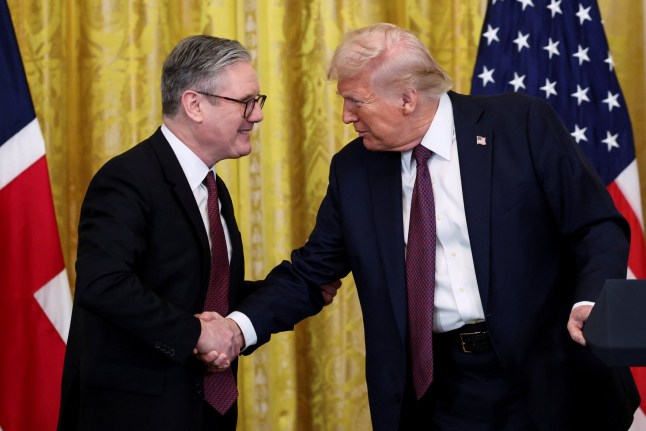 U.S. President Donald Trump and British Prime Minister Keir Starmer shake hands at a press conference at the White House in Washington, D.C., U.S., February 27, 2025. REUTERS/Kevin Lamarque