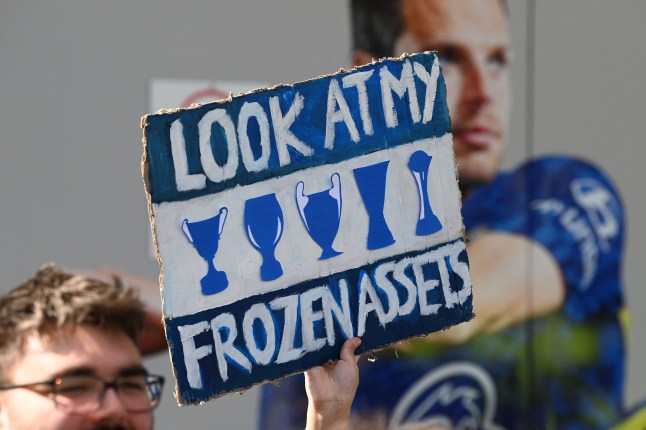 A sign reading 'Look at my frozen assets'