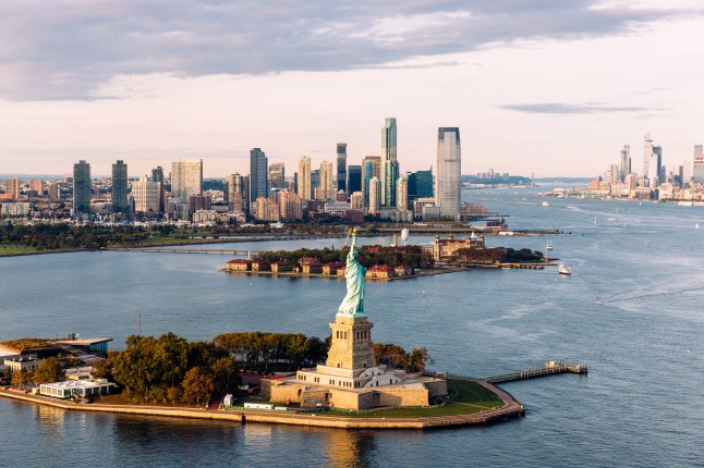 Statue of Liberty and New York skyline in background