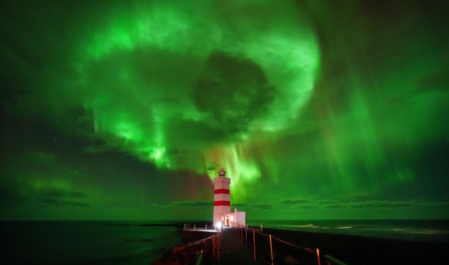 The aurora borealis, also known as the northern lights, visible above Old Gardur Lighthouse on the northern point of the Reykjanes peninsula in Iceland. The lighthouse dates to 1897, and was one of the first built in Iceland. Picture date: Sunday November 24, 2024. PA Photo. Photo credit should read: Owen Humphreys/PA Wire