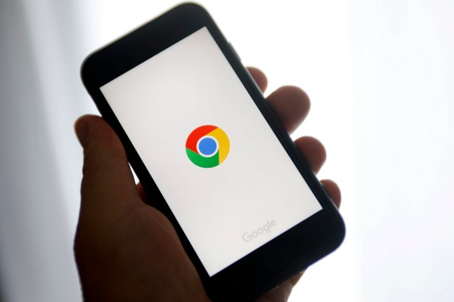 PARIS, FRANCE - JUNE 08: In this photo illustration, the Google Chrome logo is displayed on the screen of an iPhone on June 08, 2023 in Paris, France. Users of the Google Chrome search engine are advised to update the software on their web browser as soon as possible to ensure their security. The American giant has just released a security update to correct a computer flaw representing a high risk for Internet users. This is the third time since the beginning of the year that Google has spotted a "zero day" flaw, that is to say, a computer flaw not directly resolved, a favorite prey of hackers.(Photo illustration by Chesnot/Getty Images)