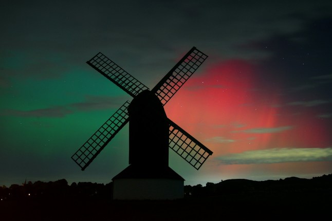 PITSTONE, UNITED KINGDOM - OCTOBER 10: The Aurora Borealis light up the night sky over Pitstone Windmill in Buckinghamshire on October 10, 2024 in Pitstone, United Kingdom. The Aurora Borealis or "Northern Lights" results from geomagnetic storms and can be seen as far south as the UK overnight on the 10th October. (Photo by Jim Dyson/Getty Images)