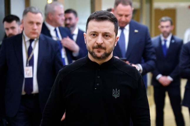 Ukraine's President Volodymyr Zelensky walks in a EU headquarters corridor after his meeting with France's President on the sidelines of the Special European Council to discuss continued support for Ukraine and European defence, at the EU headquarters in Brussels on March 6, 2025. European Union leaders hold emergency talks in Brussels gathering as the Trump administration upends traditional alliances and retracts wartime backing of Ukraine. The summit brings all 27 EU leaders together for the first time since the explosive meeting between US and Ukraine presidents on February 28, 2025, with US military aid and intelligence sharing since suspended. (Photo by Ludovic MARIN / POOL / AFP) (Photo by LUDOVIC MARIN/POOL/AFP via Getty Images)