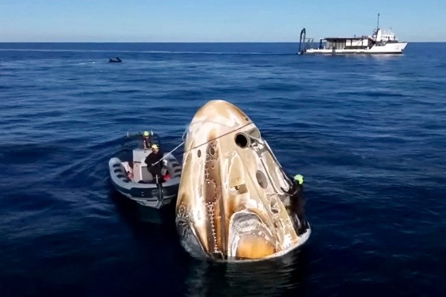 epa11972860 A frame grab from live streamed NASA video of the SpaceX Crew Dragon capsule surrounded by recovery teams after splashing down off the coast Tallahassee, Florida, USA, 18 March 2025. Four astronauts are on the capsule, including NASA astronauts Suni Williams and Butch Wilmore, who have been on the International Space Station for nine months after their planned eight day mission was extended due to spacecraft problems. EPA/NASA VIDEO FRAME GRAB HANDOUT HANDOUT EDITORIAL USE ONLY/NO SALES