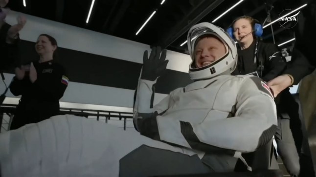 14512727 NASA astronauts finally splash down and are stretchered off for health checks after nine grueling months in space