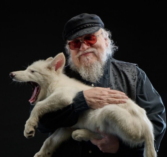 George R R Martin with a dire wolf