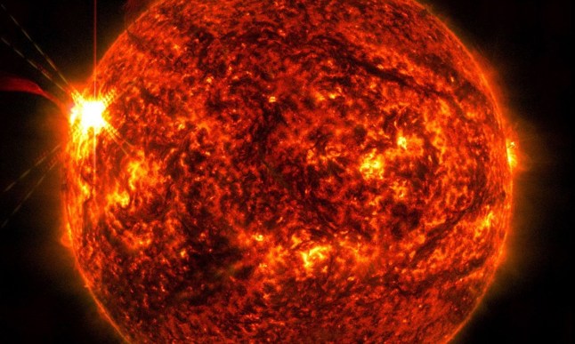 NASA?s Solar Dynamics Observatory captured this image of a solar flare ? seen as the bright flash on the left ? on May 14. A pair of powerful X-class flares from the Sun have caused radio blackouts this week. Huge X-class flares knocked out signals across southeast Asia, Europe, and the Middle East, according to space.com. The first occurred Tuesday (13 May), while the strongest solar flare of the year - classified as an X2.7 event - erupted on the other side of the Sun the next day. NASA?s Solar Dynamics Observatory, which watches the Sun constantly, captured images of the events. Solar flares can cause coronal mass ejections (CME); explosions of plasma and magnetic field that can cause geomagnetic storms when they are directed at Earth. However, it is thought the flares were not facing our planet.