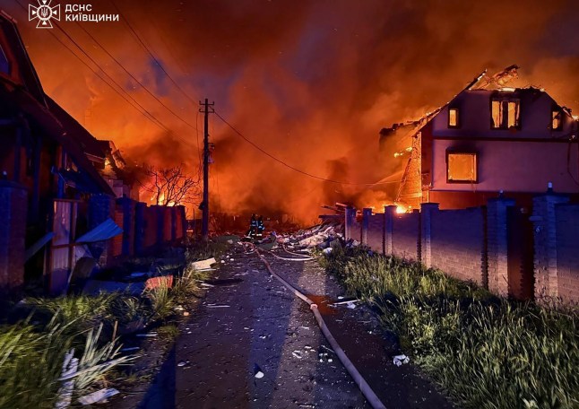 Mandatory Credit: Photo by Ukrainian State Emergency Service Press Service/UPI/Shutterstock (15319578a) Ukrainian a firefighters operating on burning houses following Russian strike in Kyiv region, amid Russian invasion in Ukraine. Russian strikes killed three people in the Kyiv region overnight, a Ukrainian official said, Sunday, May 25, 2025, officials said, as Kyiv and Moscow traded fire amid an ongoing major prisoner swap. Ukraine's emergency services described a night of "terror" as Russia launched a second straight night of massive air strikes on Ukraine, including on the capital Kyiv. Russian Strikes Killed At Least 12 People in Ukraine, Kyiv - 25 May 2025