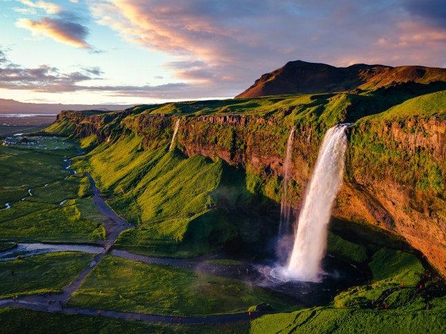 Aerial drone view of Seljalandsfoss waterfall at sunset, Iceland