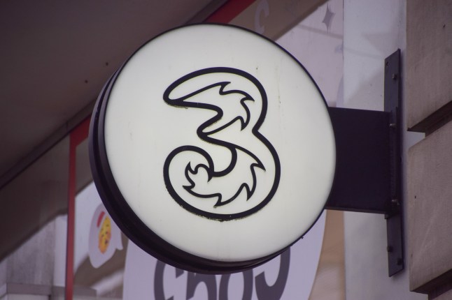 The logo of the Three mobile phone store in Oxford Street