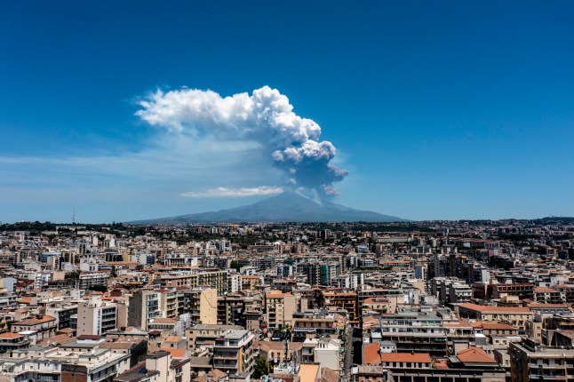 Smoke billowing from Mount Etna in Sicily, Italy after a volcanic eruption.