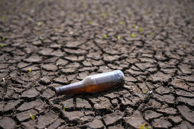 WOODHEAD, DERBYSHIRE - JUNE 11: A bottle sits on the dried out bed of the Woodhead Reservoir on June 11, 2025 in Woodhead, Derbyshire. The National Drought Group, convened by the UK's Environment Agency, has said England saw its driest spring in 132 years, with May bringing only 57% of the long-term average rainfall. A drought has been declared in the north-west, and the north-east, Yorkshire, east and west midlands experiencing prolonged dry weather. Although recent rainfall has helped stabilize the situation, diminished reservoir levels have sparked concern over potential water supply challenges, as the Met Office warns that prolonged dry, sunny weather is becoming more frequent across the UK. (Photo by Christopher Furlong/Getty Images)