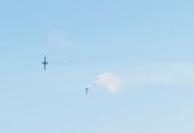 The moment Putin loses another ??15m Su-25 attack jet, pictured crashing to the ground, in frontline accident in Donetsk region as pilot cheats death in mid-air break-up