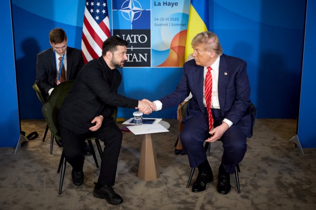 TOPSHOT - In this handout photograph taken and released by the Ukrainian Presidential Press Service on June 25, 2025, Ukraine's President Volodymyr Zelensky (L) shakes hands with US President Donald Trump during their meeting on the sideline of the North Atlantic Treaty Organization (NATO) summit in The Hague. (Photo by Handout / UKRAINIAN PRESIDENTIAL PRESS SERVICE / AFP) / RESTRICTED TO EDITORIAL USE - MANDATORY CREDIT "AFP PHOTO / Ukrainian Presidential Press Service" - NO MARKETING NO ADVERTISING CAMPAIGNS - DISTRIBUTED AS A SERVICE TO CLIENTS (Photo by HANDOUT/UKRAINIAN PRESIDENTIAL PRESS SERVICE/AFP via Getty Images)