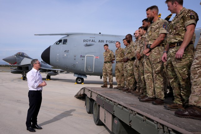 AKROTIRI, CYPRUS - DECEMBER 10: Britain's Prime Minister Keir Starmer speaks to soldiers at RAF Akrotiri on December 10, 2024 in Akrotiri, Cyprus. Prime Minister Starmer is traveling to the United Arab Emirates, the Kingdom of Saudi Arabia, and the Republic of Cyprus between December 8-10. (Photo by Kirsty Wigglesworth - WPA Pool/Getty Images)