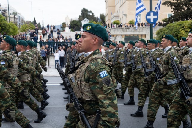 Members of the Commando Forces parade in front of the Greek Parliament during Greek Independence Day in Athens, Greece, on March 25. (Photo by Sophia Potsi/NurPhoto via Getty Images)