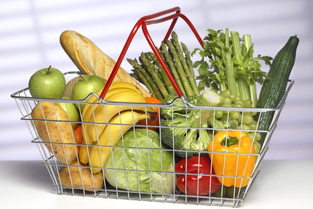 A shopping basket full of fruit and vegetables