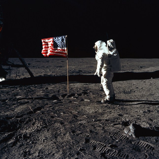 Buzz Aldrin and the U.S. Flag on the Moon, 1969. Astronaut Buzz Aldrin, lunar module pilot of the first lunar landing mission, poses for a photograph beside the deployed United States flag during an Apollo 11 Extravehicular Activity (EVA) on the lunar surface. The Lunar Module (LM) is on the left, and the footprints of the astronauts are clearly visible in the soil of the Moon. Astronaut Neil A. Armstrong, commander, took this picture with a 70mm Hasselblad lunar surface camera. While astronauts Armstrong and Aldrin descended in the LM, the "Eagle", to explore the Sea of Tranquility region of the Moon, astronaut Michael Collins, command module pilot, remained with the Command and Service Modules (CSM) "Columbia" in lunar-orbit. Artist Neil Armstrong. (Photo by Heritage Space/Heritage Images via Getty Images)