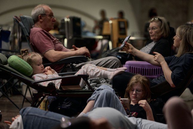 KYIV, UKRAINE - JULY 4: Residents descended into the metro for shelter during an air raid and a massive kamikaze drone attack on the center of the capital July 4, 2025 in Kyiv, Ukraine. (Photo by Kostiantyn Liberov/Libkos/Getty Images)