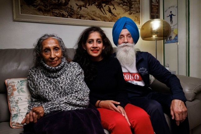 FOR METRO Minreet Kaur, 42, who has lived with her parents since childhood. Pictured: Minreet (C) with her parents in their living room. Shot on 11th November 2024. (C) Belinda Jiao 07598931257 www.belindajiao.com jiao.bilin@gmail.com