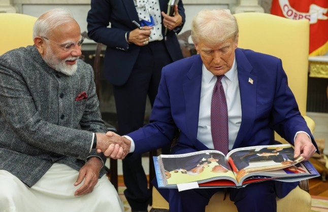 Mandatory Credit: Photo by Pib/Press Information/Planet Pix via ZUMA Press Wire/Shutterstock (15150661i) Indian Prime Minister Narendra Modi, left, shakes hands with U.S President Donald Trump, right, as he looks through a book at the start of their bilateral meeting at the Oval Office of the White House, February 13, 2025 in Washington D.C. Indian Prime Minister Modi Bilateral with U.S President Trump, Washington, Dc, United States - 13 Feb 2025