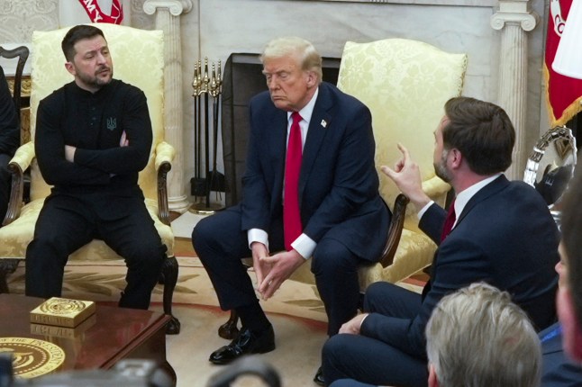 FILE - U.S. Vice President JD Vance, right, speaks with Ukrainian President Volodymyr Zelenskyy, left, as President Donald Trump listens, in the Oval Office at the White House on Feb. 28, 2025, in Washington. (AP Photo/ Mystyslav Chernov, File)