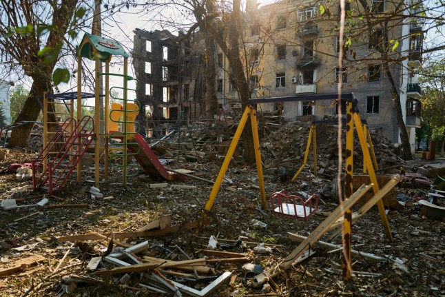 KRAMATORSK, UKRAINE - AUGUST 6: Rescuers from Ukraine's Emergency Services search through the rubble of a building bombed by Russian forces on July 31, in an effort to recover the remains of victims on August 6, 2025 in Kramatorsk, Ukraine. The attack killed seven people and injured 11 others. U.S. President Donald Trump's special envoy, Steve Witkoff, met with Vladimir Putin at the Kremlin on August 6, two days before the deadline set by Trump for Russia to agree to a peace deal in the war in Ukraine or risk new sanctions. (Photo by Pierre Crom/Getty Images)