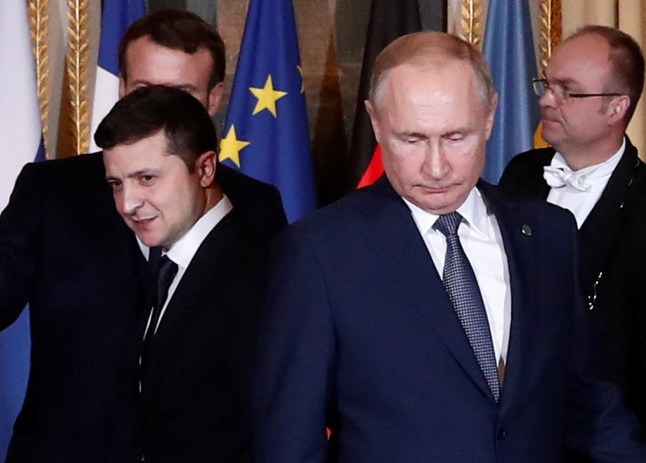 French President Emmanuel Macron, Russian President Vladimir Putin and Ukrainian President Volodymyr Zelenskiy arrive for a working session during a summit on the conflict in Ukraine at the Elysee Palace in Paris, France December 9, 2019. Ian Langsdon/Pool via REUTERS