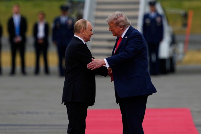 President Donald Trump greets Russia's President Vladimir Putin Friday, Aug. 15, 2025, at Joint Base Elmendorf-Richardson, Alaska. (AP Photo/Julia Demaree Nikhinson)