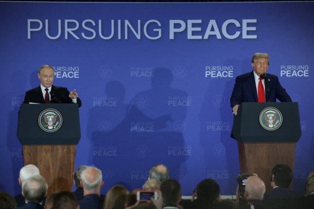 U.S. President Donald Trump and Russian President Vladimir Putin hold a press conference following their meeting to negotiate an end to the war in Ukraine, at Joint Base Elmendorf-Richardson in Anchorage, Alaska, U.S., August 15, 2025. REUTERS/Jeenah Moon