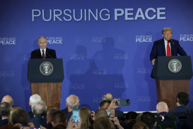U.S. President Donald Trump and Russian President Vladimir Putin hold a press conference following their meeting to negotiate an end to the war in Ukraine, at Joint Base Elmendorf-Richardson in Anchorage, Alaska, U.S., August 15, 2025. REUTERS/Jeenah Moon
