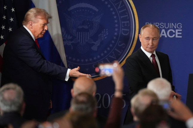 President Donald Trump, left, and Russia's President Vladimir Putin arrive for a joint press conference at Joint Base Elmendorf-Richardson, Alaska, Friday, Aug. 15, 2025. (AP Photo/Jae C. Hong)