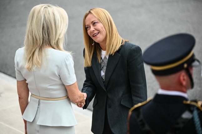 Italian Prime Minister Giorgia Meloni is greeted by US Chief of Protocol Monica Crowley (L) upon arrival at the White House South Portico in Washington, DC, on August 18, 2025. European leaders join Ukrainian President Volodymyr Zelensky in talks with US President Donald Trump on August 18, as they try to find a way to end Russia's offensive. The leaders heading to Washington on Monday to appear alongside Zelensky call themselves the "coalition of the willing." (Photo by Mandel NGAN / AFP) (Photo by MANDEL NGAN/AFP via Getty Images)