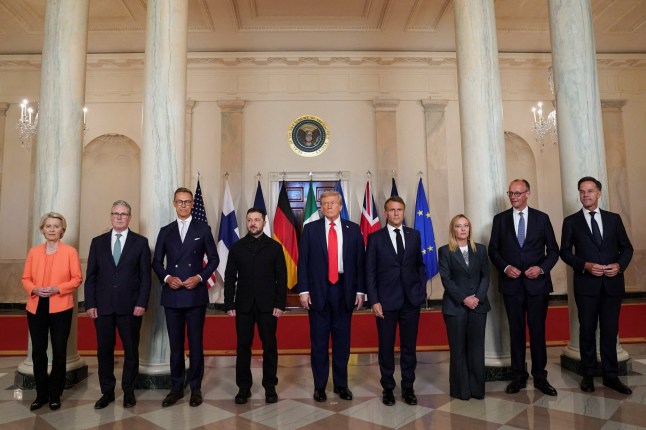 U.S. President Donald Trump, Ukrainian President Volodymyr Zelenskiy, German Chancellor Friedrich Merz, French President Emmanuel Macron, British Prime Minister Keir Starmer, Italian Prime Minister Giorgia Meloni, NATO Secretary General Mark Rutte, European Commission President Ursula von der Leyen, and Finland's President Alexander Stubb, pose for a family photo amid negotiations to end the Russian war in Ukraine, at the White House in Washington, D.C., U.S., August 18, 2025. REUTERS/Alexander Drago