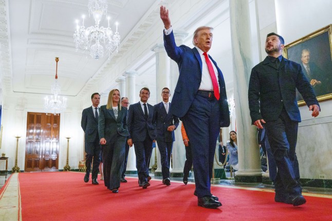 United States President Donald J Trump leads President Volodymyr Zelenskyy of Ukraine and President Ursula von der Leyen of the European Commission, Prime Minister Keir Starmer of the United Kingdom, President Alexander Stubb of Finland President Emmanuel Macron of France, Prime Minister Giorgia Meloni of the Italian Republic Chancellor Friedrich Merz of Germany Mark Rutte, Secretary General of the North Atlantic Treaty Organization (NATO) in the Cross Hall of the White House in Washington, DC, US. Picture date: Monday August 18, 2025. PA Photo. Photo credit should read: Aaron Schwartz/PA Wire