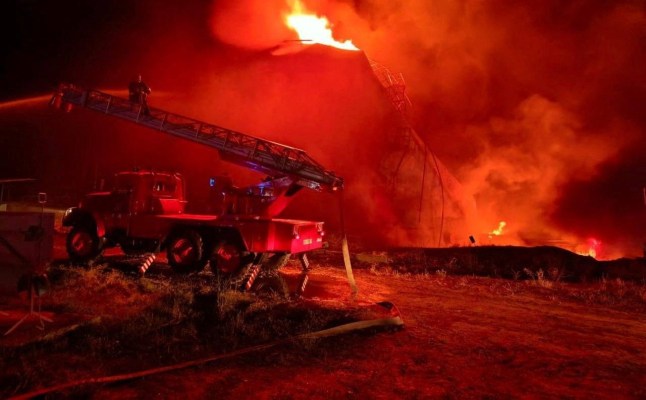 A firefighter works at the site of a fuel storage facility hit by a Russian drone strike, amid Russia's attack on Ukraine, in Odesa region, Ukraine August 20, 2025. Press service of the State Emergency Service of Ukraine in Odesa region/Handout via REUTERS ATTENTION EDITORS - THIS IMAGE HAS BEEN SUPPLIED BY A THIRD PARTY. DO NOT OBSCURE LOGO.