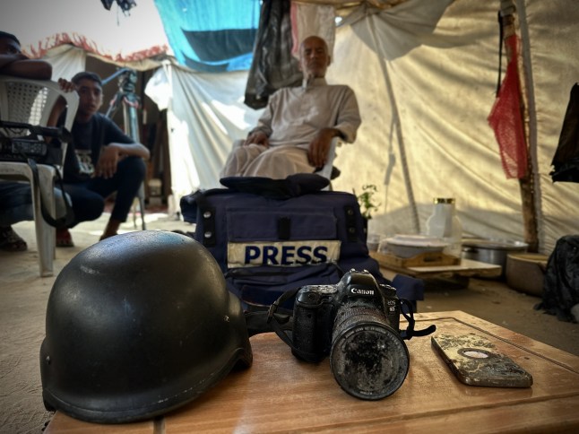 KHAN YUNIS, GAZA - AUGUST 27: The camera, press vest, helmet and mobile phone belonging to the Mariam Abu Dagga, one of the five journalists killed in the Israeli army's attack on Nasser Medical Complex in Khan Yunis on August 25, are seen during an exclusive interview in Khan Yunis, Gaza on August 27, 2025. Mariam Abu Dagga, who worked as a journalist for various media organizations including Independent Arabia and AP, was one of the journalists who remained in Gaza to bring the truth to the world. The family of Mariam, a mother of one, stated that their daughter suffered greatly and was exhausted during the attacks on Gaza. (Photo by Doaa Albaz/Anadolu via Getty Images)