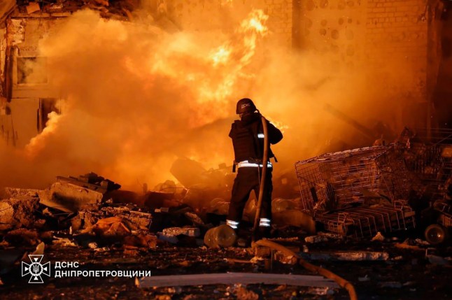 Destroyed building and firefighter in Ukraine after Russian missile attacks.