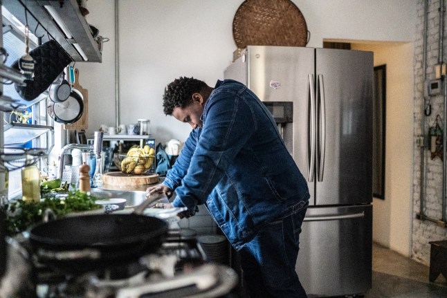 Sad mid adult man in the kitchen at home