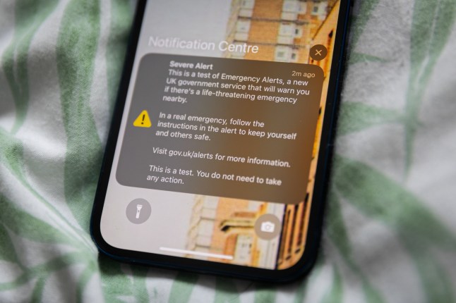 In this photo illustration, an Emergency Alert from the UK government is shown on the smartphone screen.