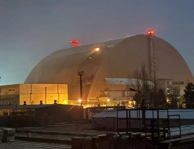 A fire can be seen burning where the dome was struck (Picture: via Reuters)