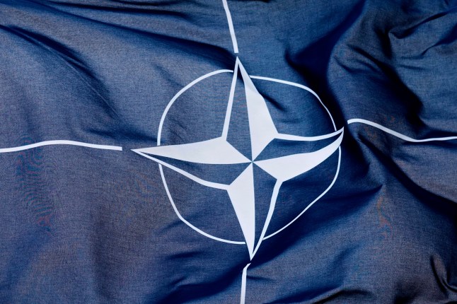 The NATO flag waves in the wind in front of the venue ahead of the upcoming NATO summit in The Hague, Netherlands, Monday, June 23, 2025. (AP Photo/Markus Schreiber)