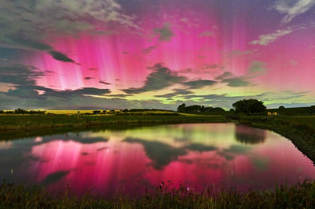 A beautiful array of pinks, purples and greens are seen in as the northern lights (aurora borealis) shine bright above Whittle Dean Reservoir in Northumberland in the early hours of this morning.